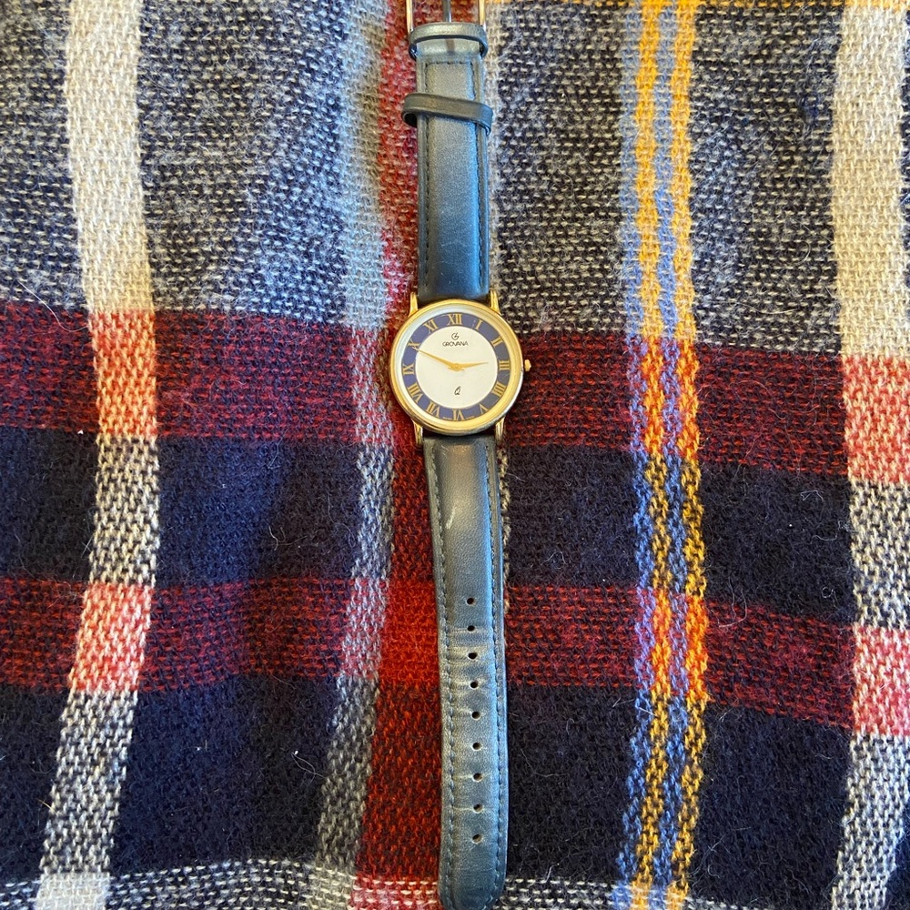Black Leather Strap Watch with Gold Rim and Classic Design